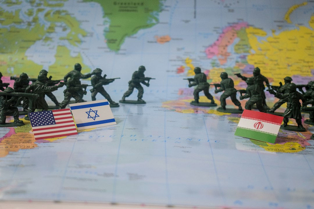toy-soldiers-face-off-with-flags-on-world-map-yzgbdjdefbi